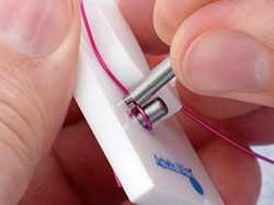 Pegs being removed from jig